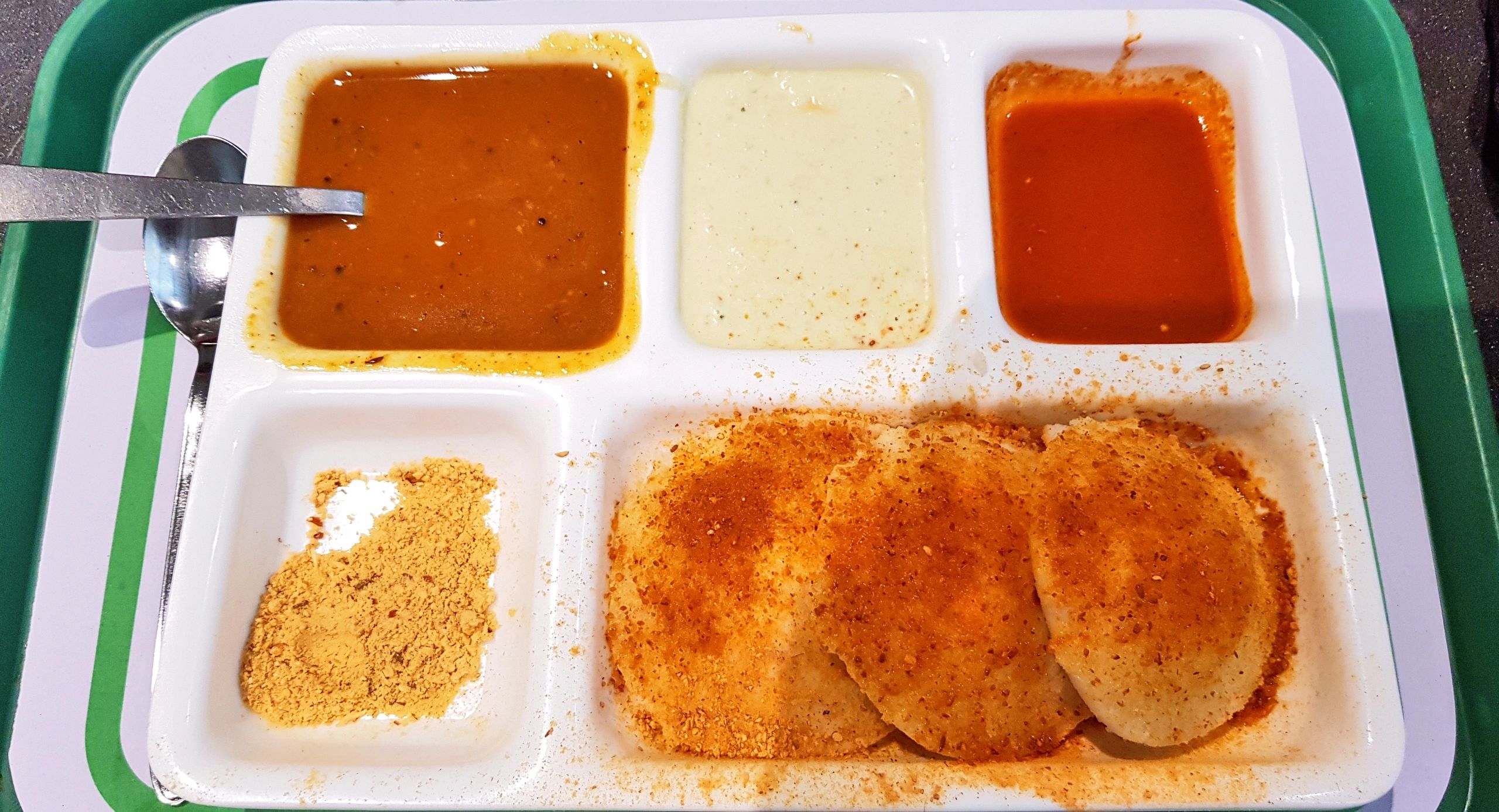 Idli sambar with coconut chutney on a plate