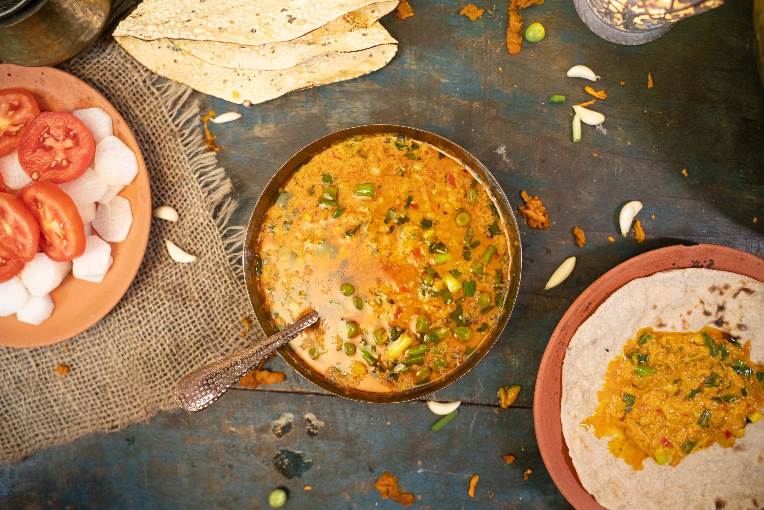 Turmeric curry in a bowl on a wooden table